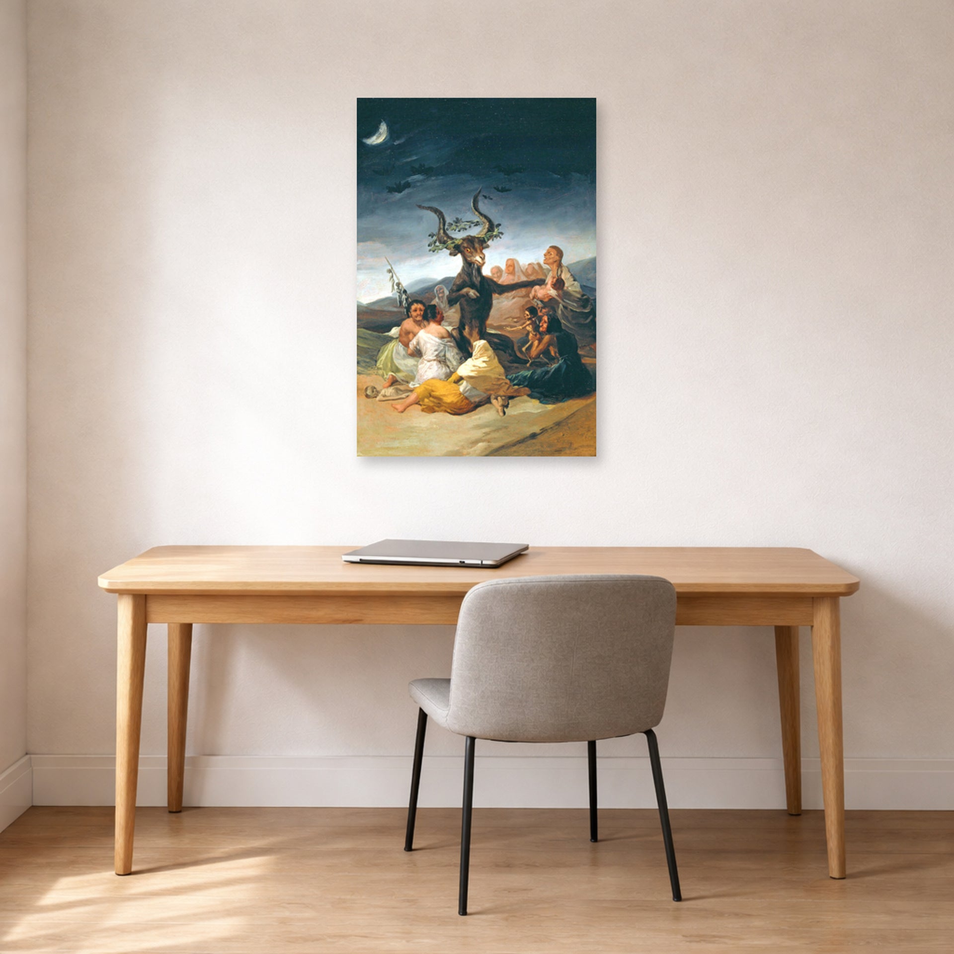 Unframed poster print of Francisco Goya's Witches Sabbath displayed on a wall in a office