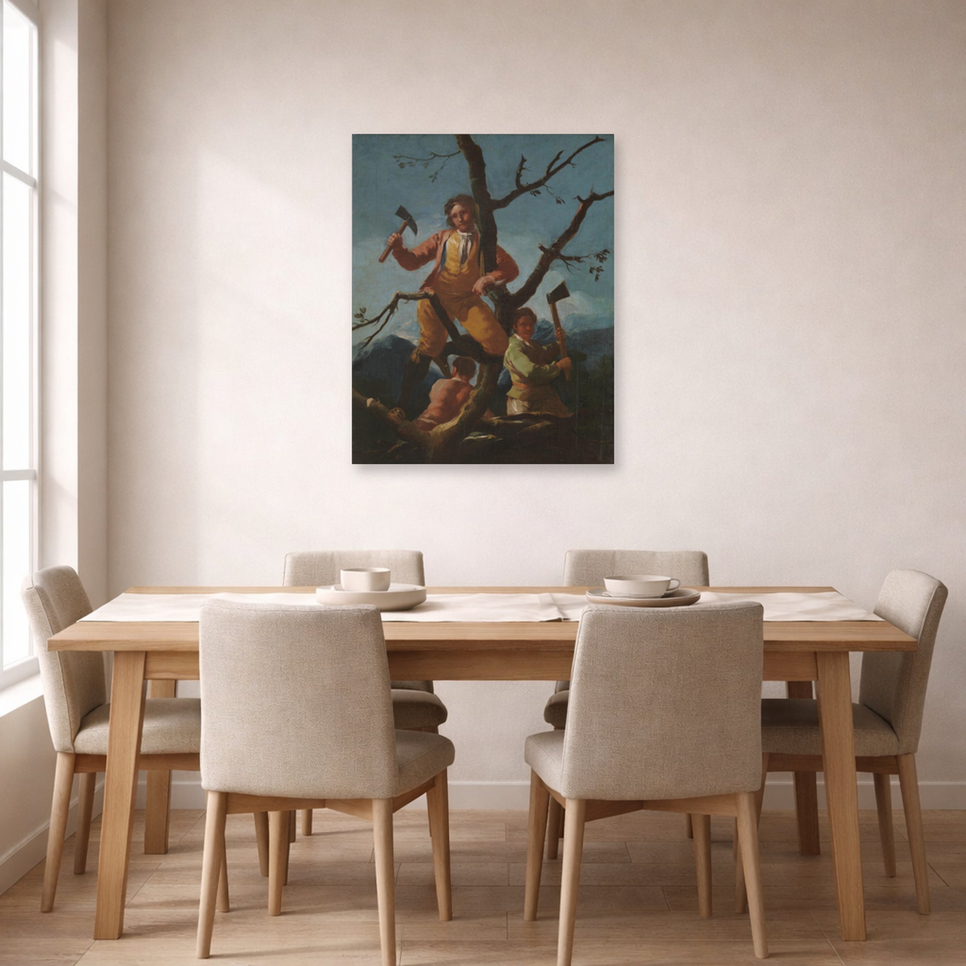Unframed poster print of Francisco Goya's Woodcutters displayed on a wall in a dining room