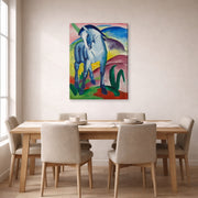 Gallery-wrapped canvas print of Franz Marc's Blue Horse displayed on a wall in a dining room