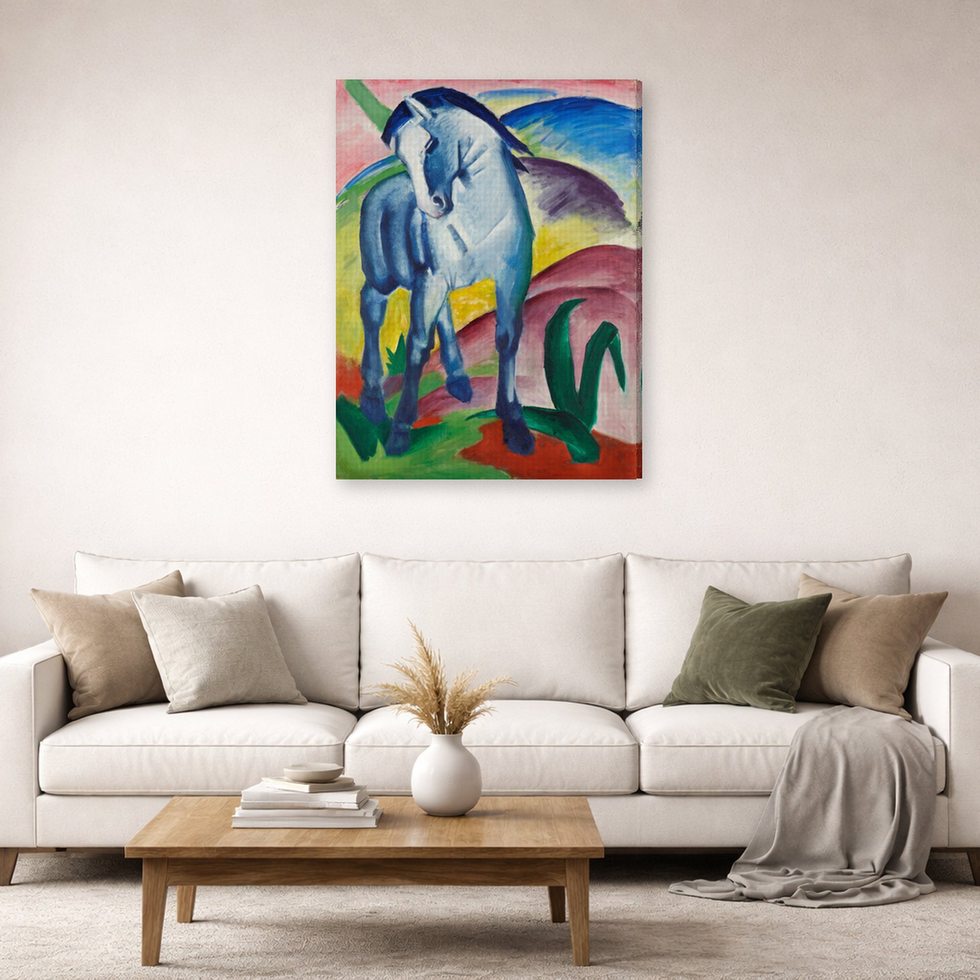Gallery-wrapped canvas print of Franz Marc's Blue Horse displayed on a wall in a living room
