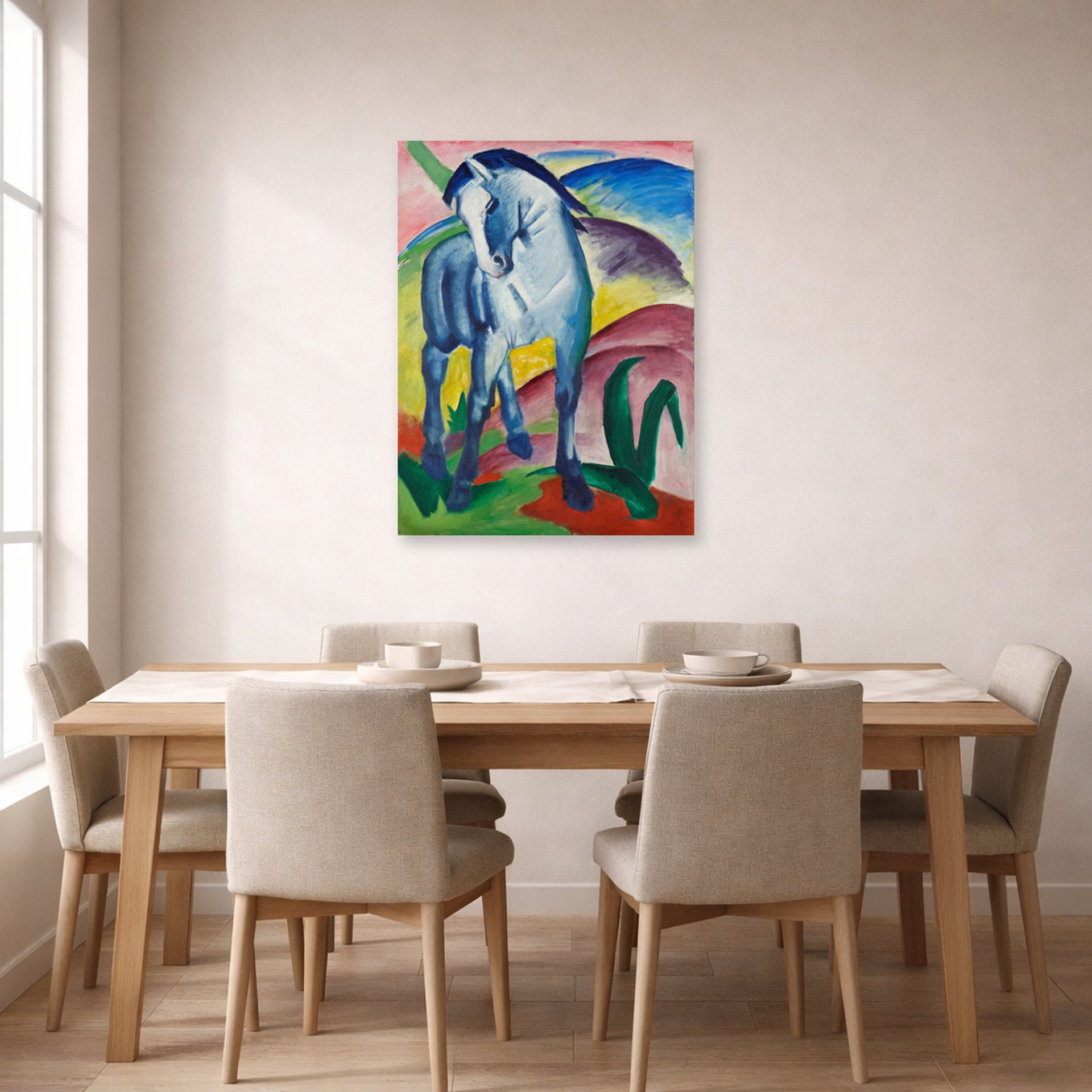Unframed poster print of Franz Marc's Blue Horse displayed on a wall in a dining room