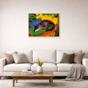 Unframed poster print of Franz Marc's Fox displayed on a wall in a living room