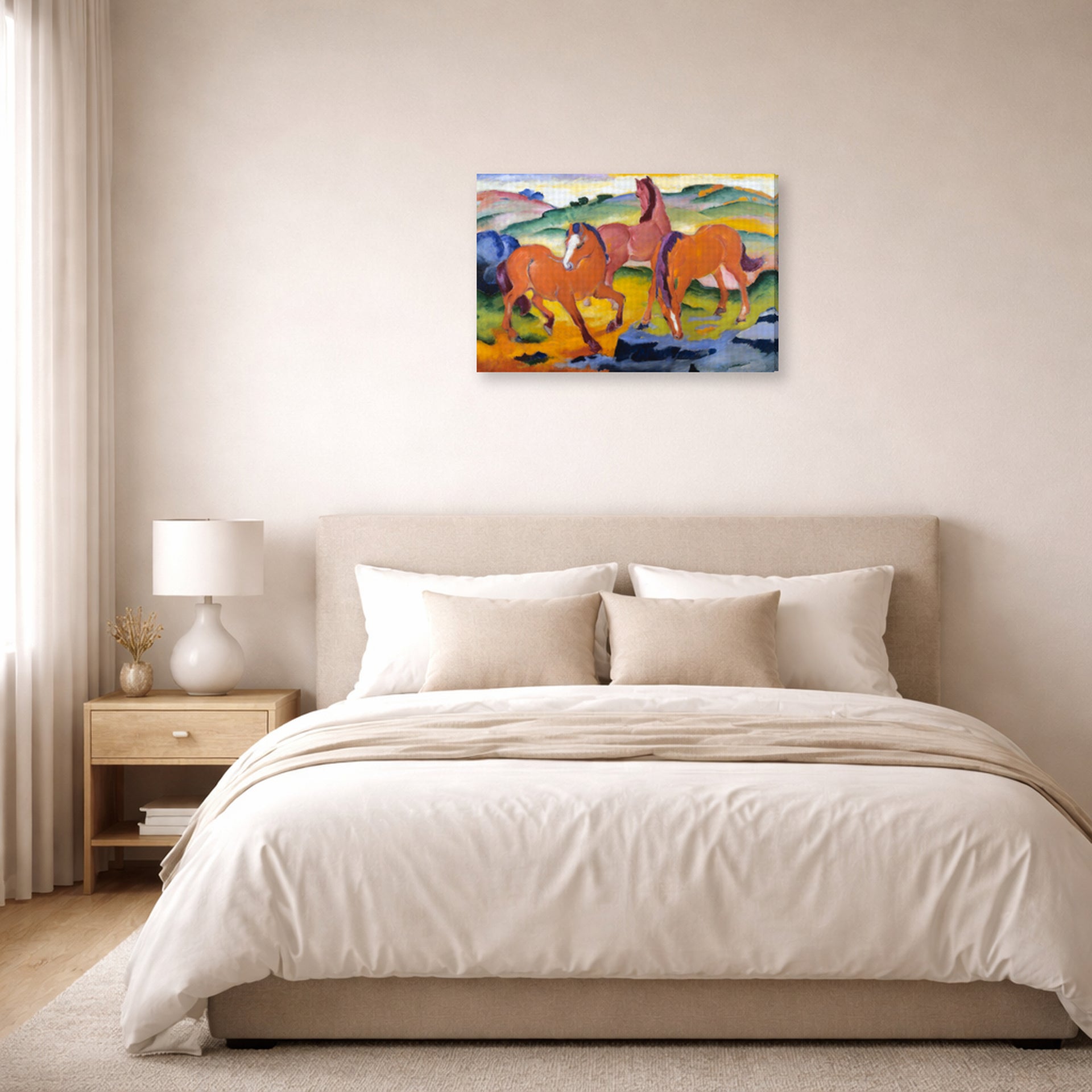 Gallery-wrapped canvas print of Franz Marc's Grazing Horses IV (The Red Horses) displayed on a wall in a bedroom