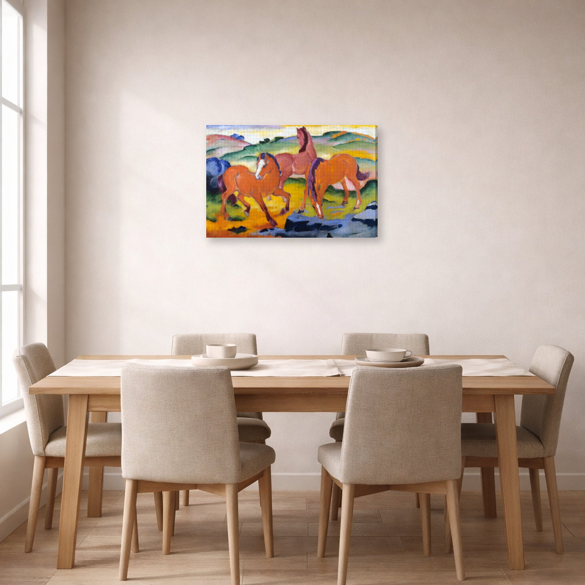 Gallery-wrapped canvas print of Franz Marc's Grazing Horses IV (The Red Horses) displayed on a wall in a dining room