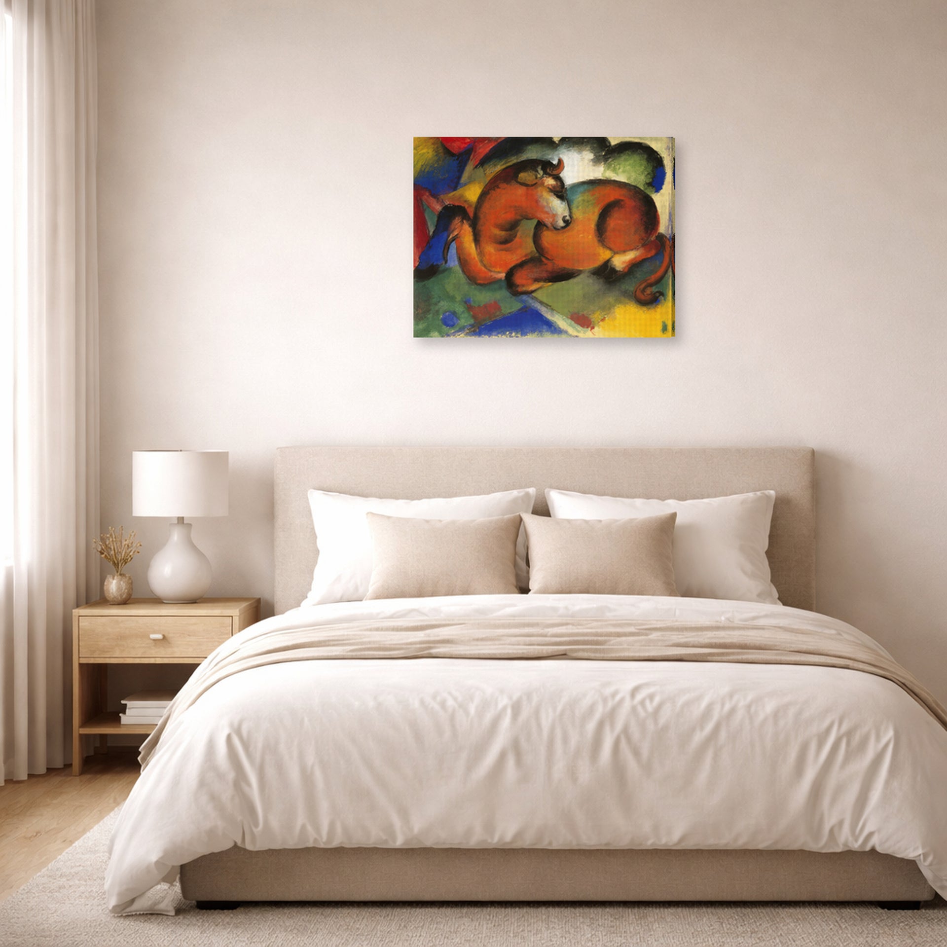 Gallery-wrapped canvas print of Franz Marc's Red Bull displayed on a wall in a bedroom