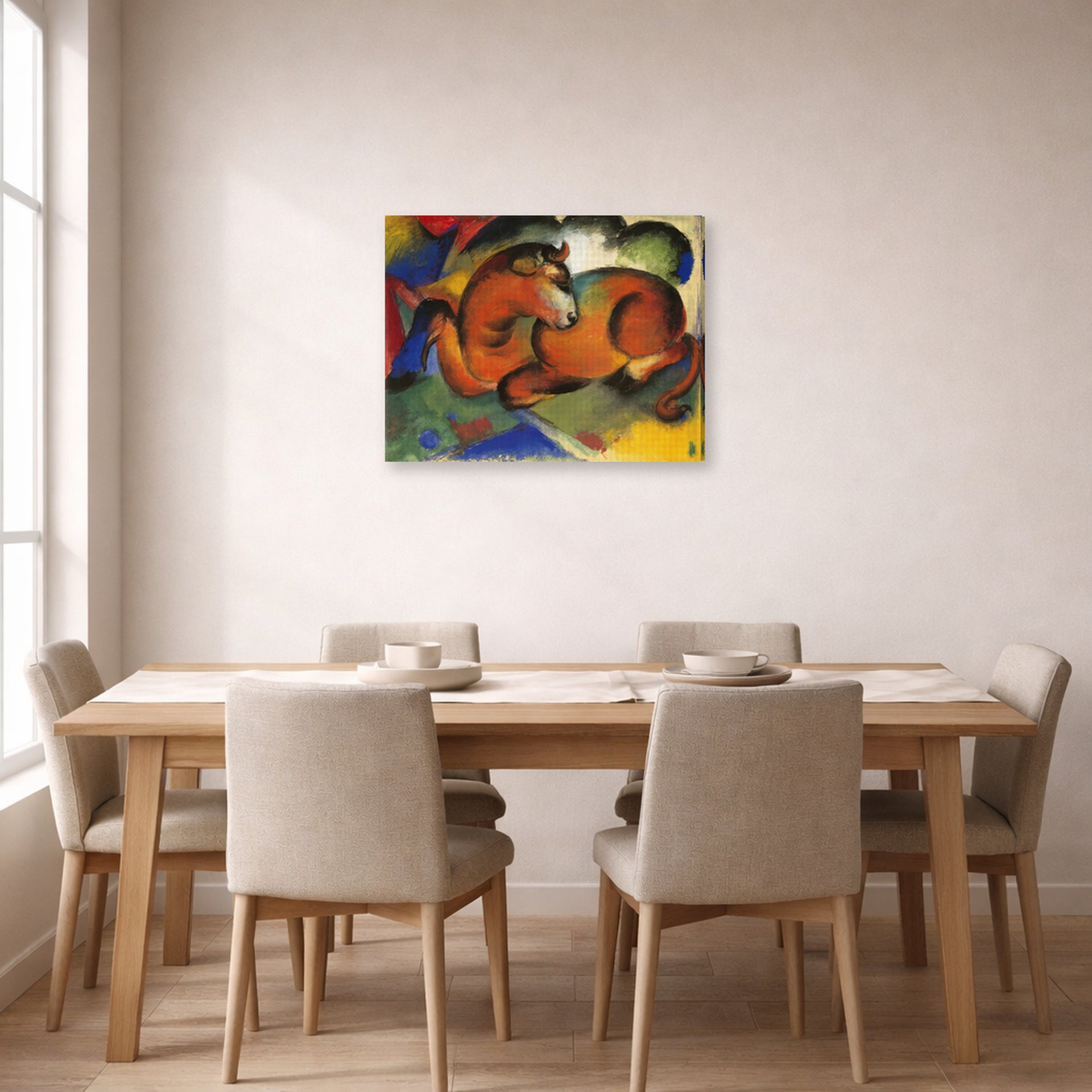Gallery-wrapped canvas print of Franz Marc's Red Bull displayed on a wall in a dining room