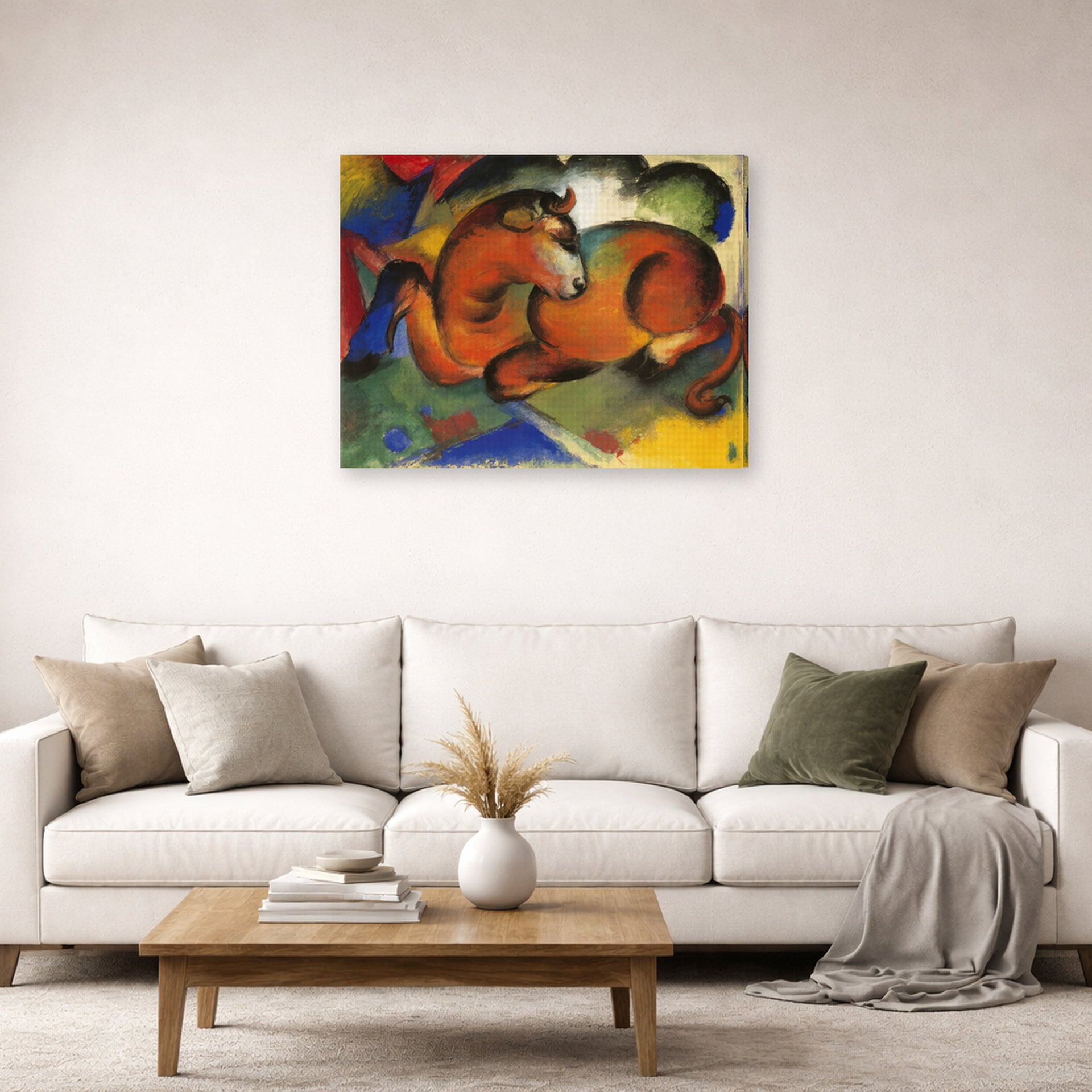 Gallery-wrapped canvas print of Franz Marc's Red Bull displayed on a wall in a living room