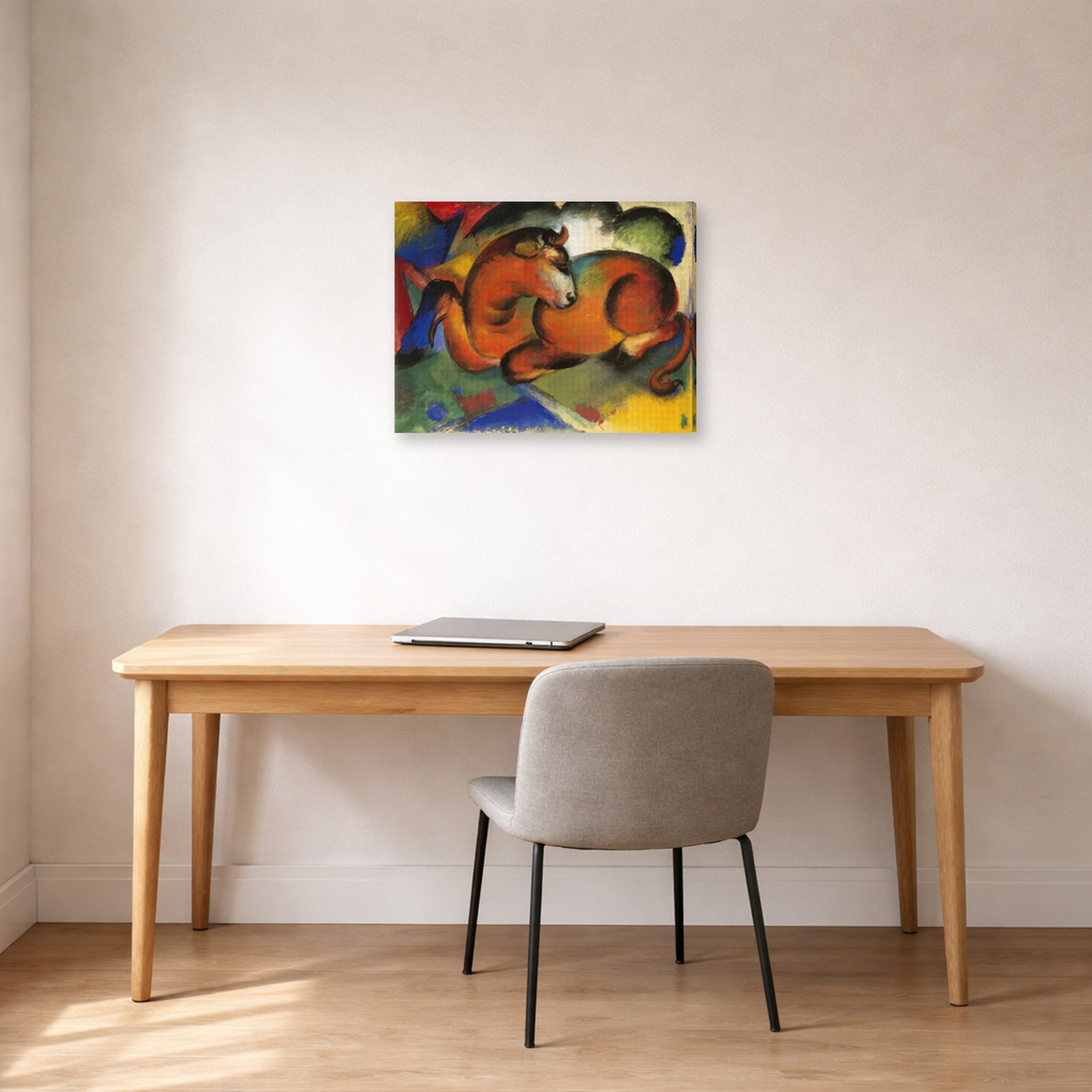 Gallery-wrapped canvas print of Franz Marc's Red Bull displayed on a wall in an office