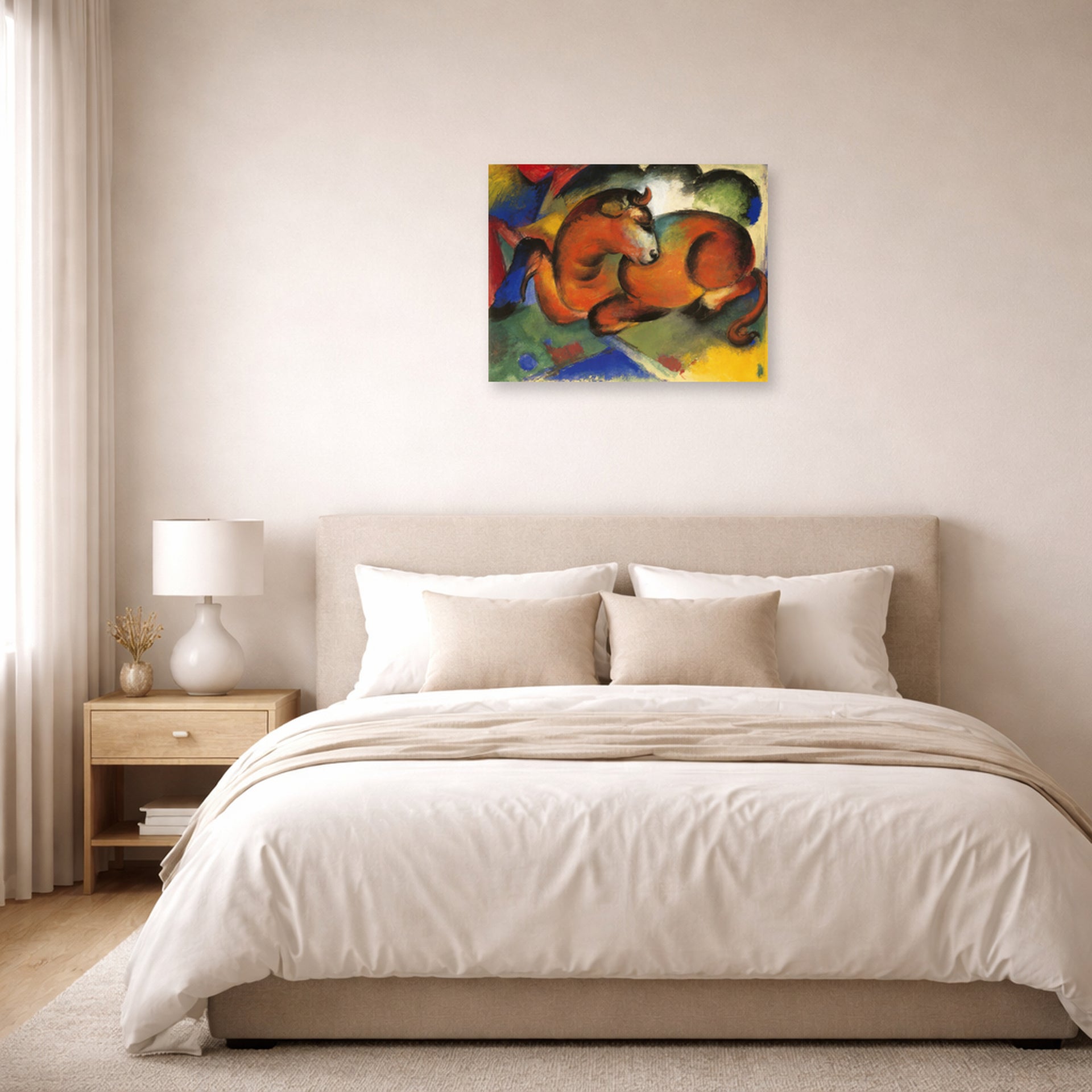 Unframed poster print of Franz Marc's Red Bull displayed on a wall in a bedroom