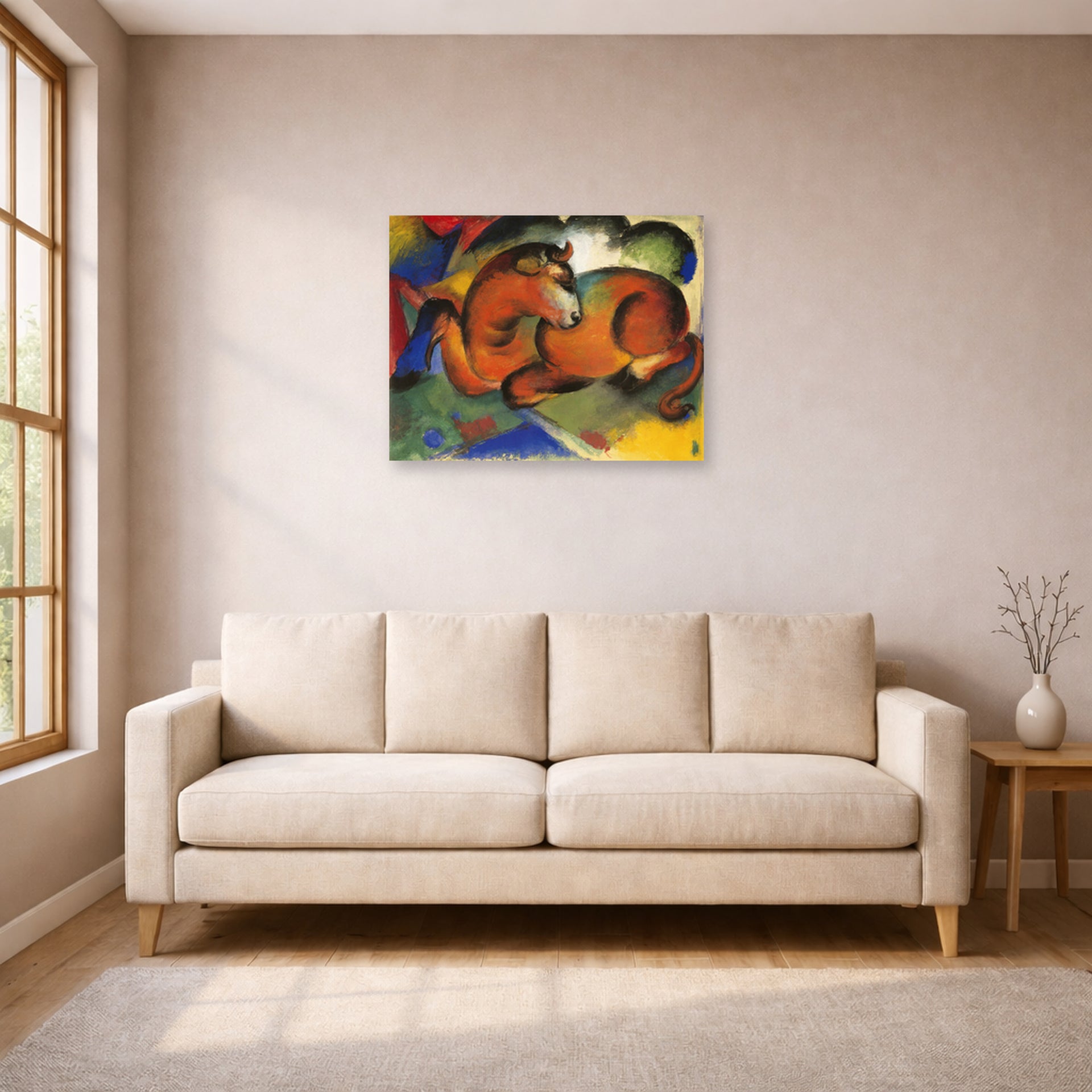 Unframed poster print of Franz Marc's Red Bull displayed on a wall in a living room