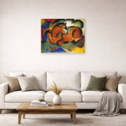 Unframed poster print of Franz Marc's Red Bull displayed on a wall in a living room