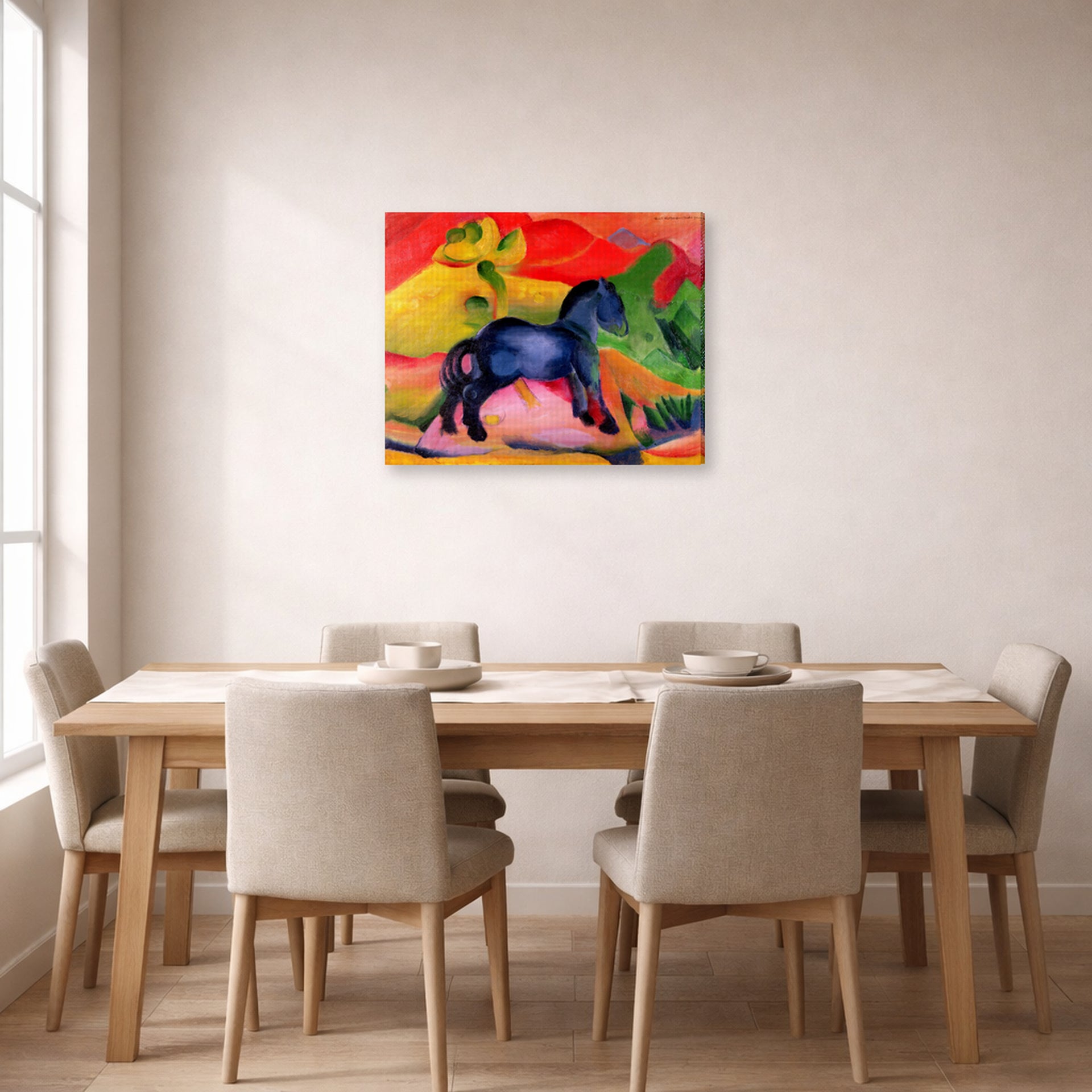 Gallery-wrapped canvas print of Franz Marc's The Little Blue Horse displayed on a wall in a dining room