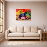 Gallery-wrapped canvas print of Franz Marc's The Little Blue Horse displayed on a wall in a living room