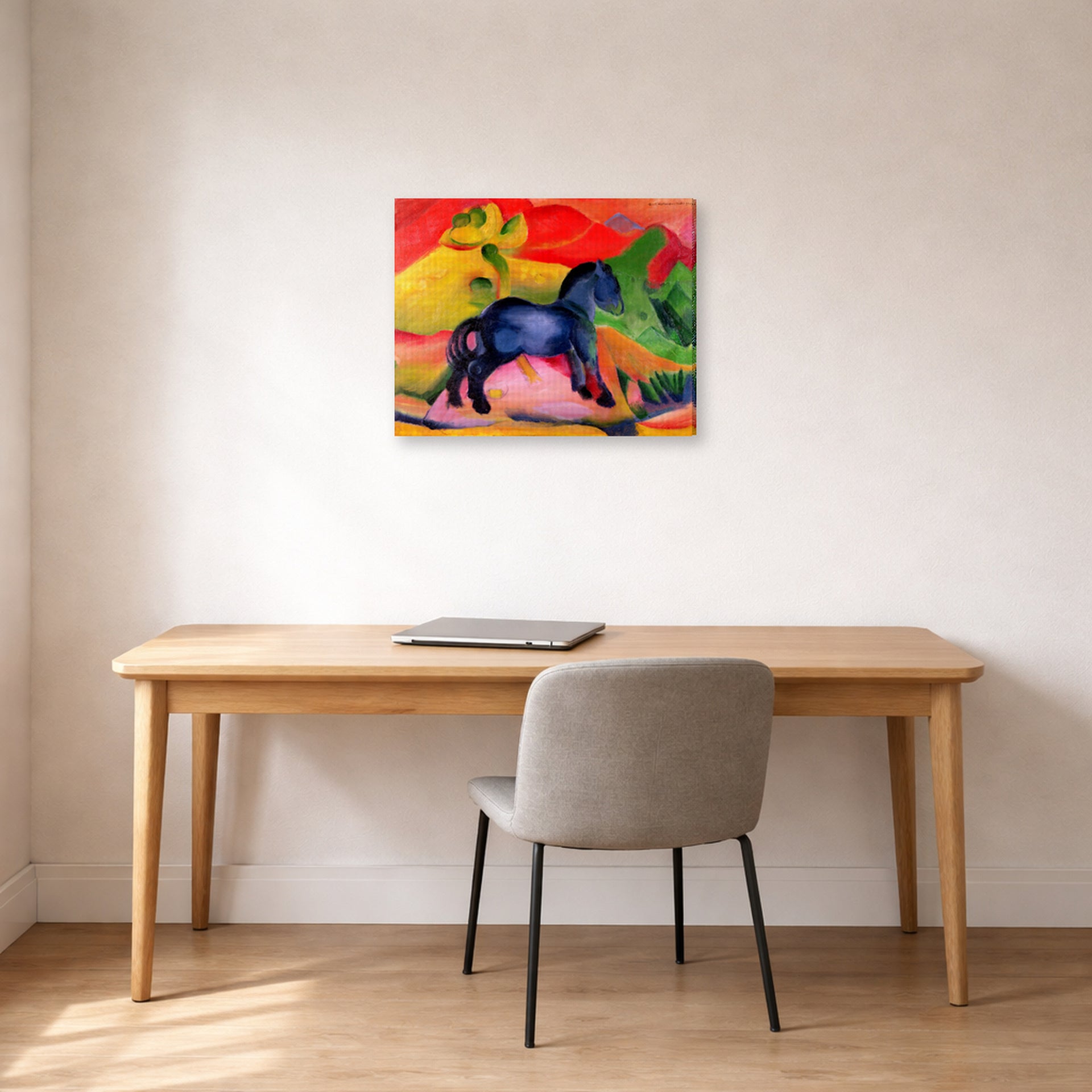 Gallery-wrapped canvas print of Franz Marc's The Little Blue Horse displayed on a wall in an office