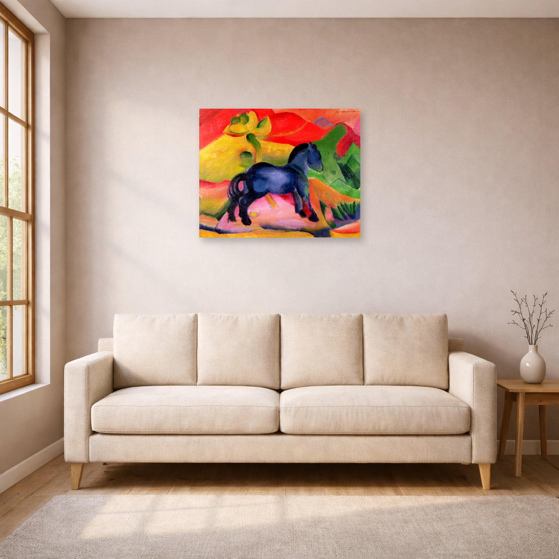 Unframed poster print of Franz Marc's The Little Blue Horse displayed on a wall in a living room