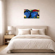 Gallery-wrapped canvas print of Franz Marc's The Little Blue Horses displayed on a wall in a bedroom