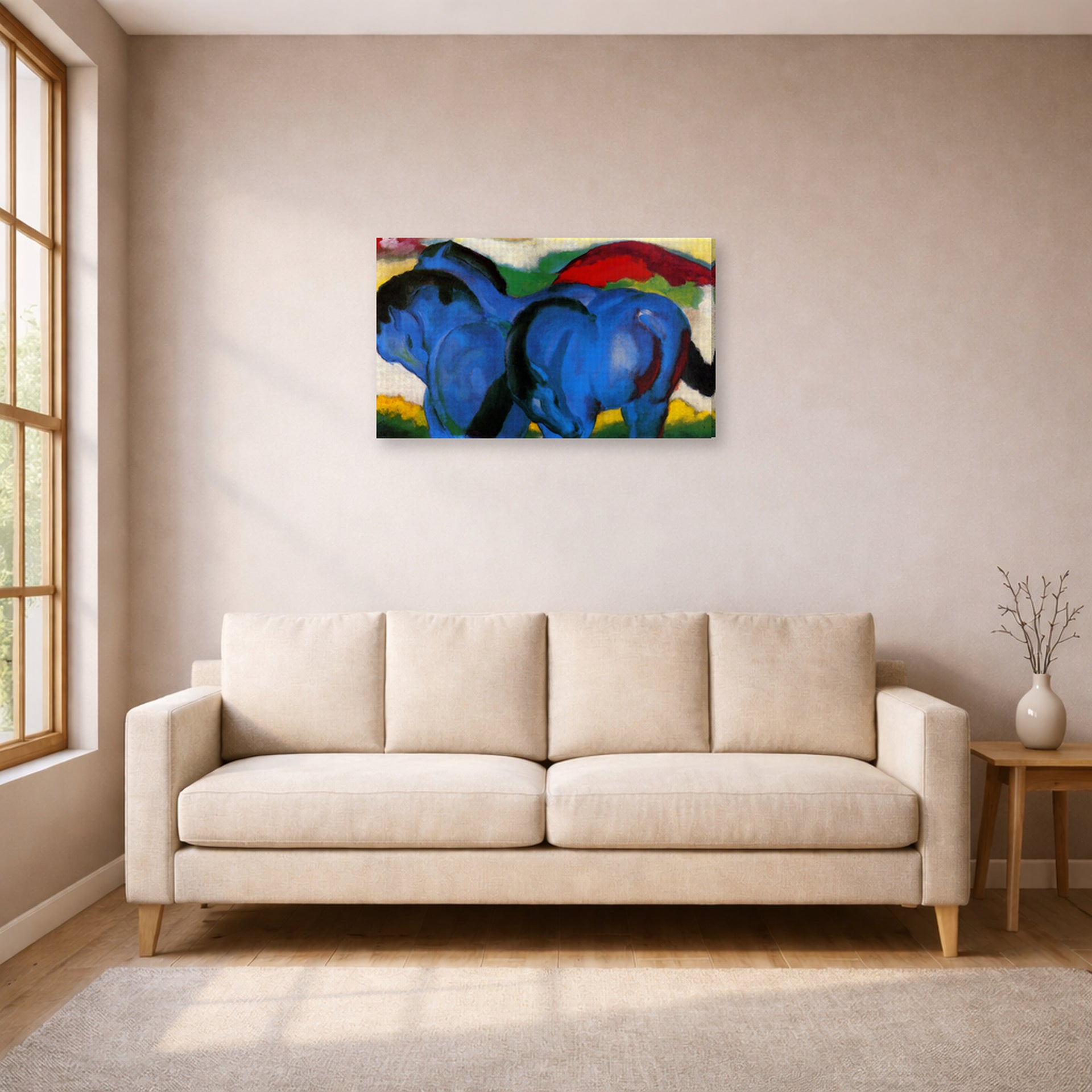 Gallery-wrapped canvas print of Franz Marc's The Little Blue Horses displayed on a wall in a living room