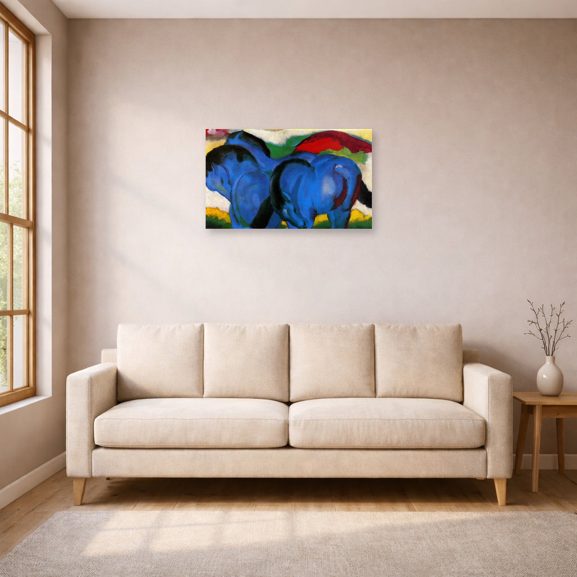 Unframed poster print of Franz Marc's The Little Blue Horses displayed on a wall in a living room