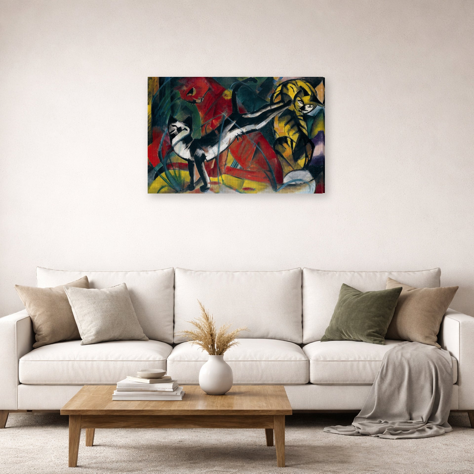 Gallery-wrapped canvas print of Franz Marc's Three Cats displayed on a wall in a living room