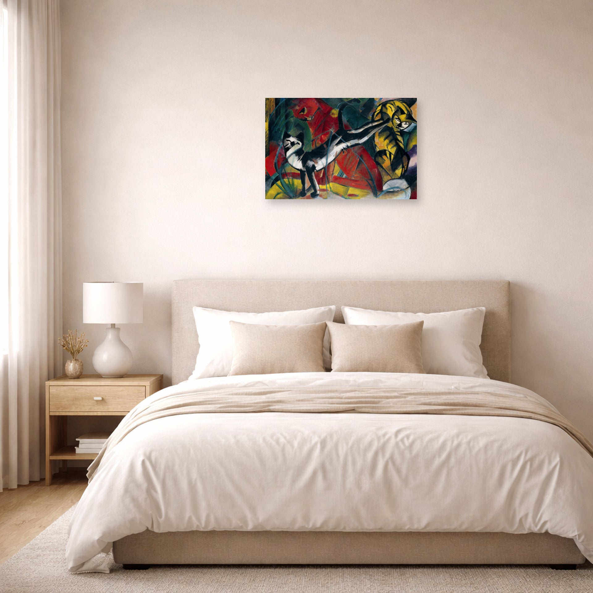 Unframed poster print of Franz Marc's Three Cats displayed on a wall in a bedroom
