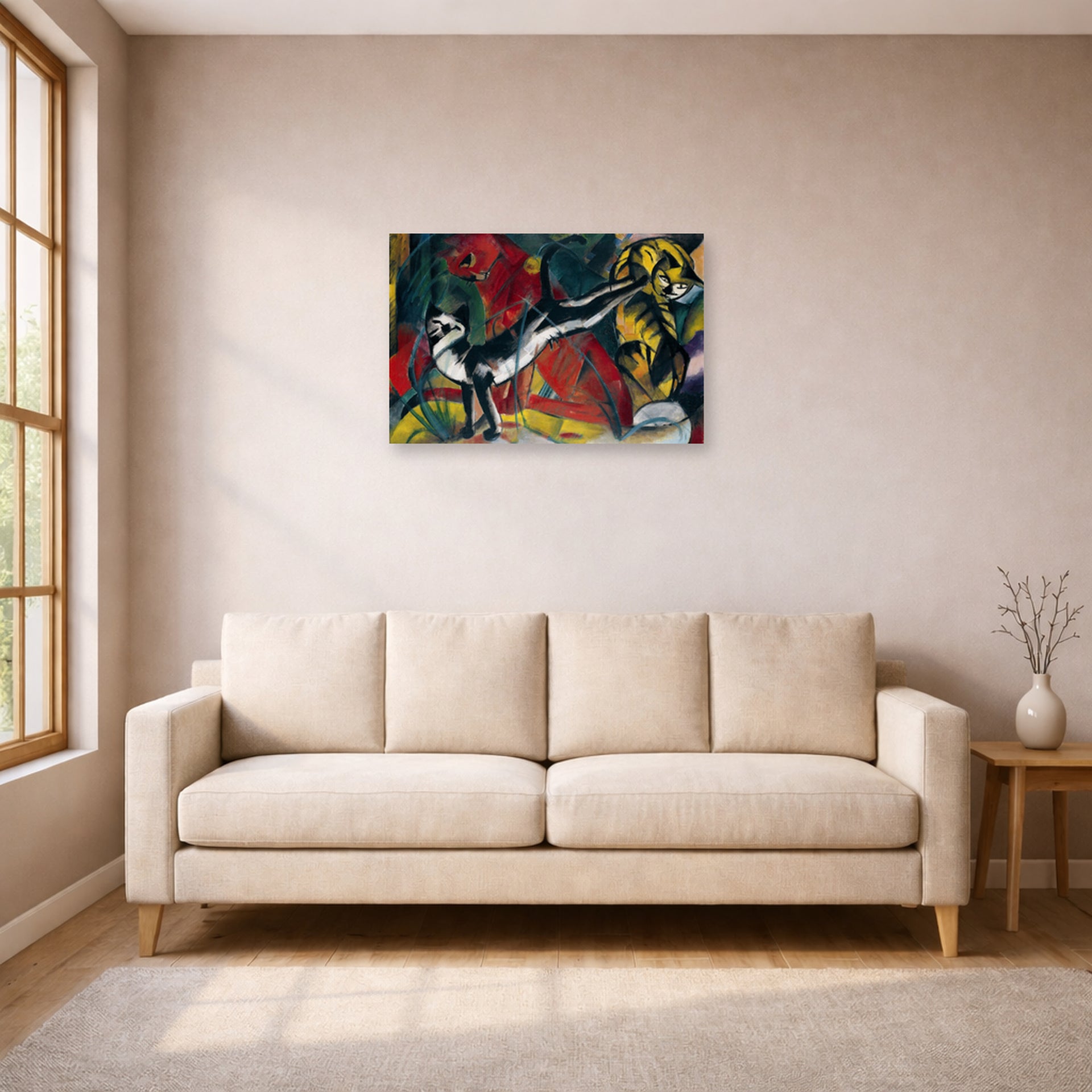 Unframed poster print of Franz Marc's Three Cats displayed on a wall in a living room