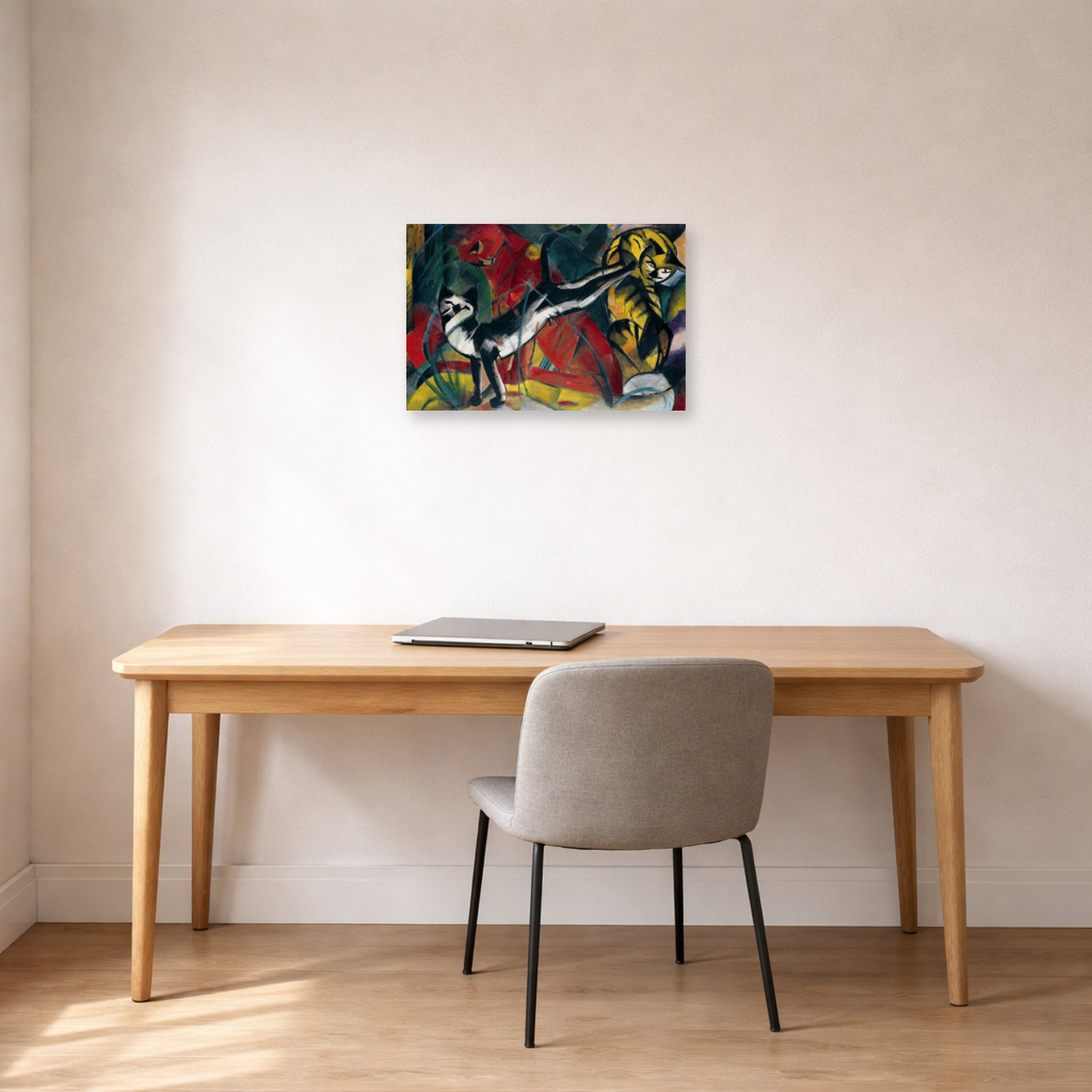 Unframed poster print of Franz Marc's Three Cats displayed on a wall in an office