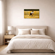 Gallery-wrapped canvas print of Georges Seurat's The Mower displayed on a wall in a bedroom