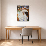 Unframed poster print of Gustav Klimt's 'Mother and Child' displayed on a wall in an office