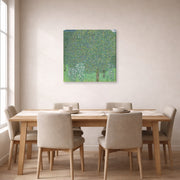Gallery-wrapped canvas print of Gustav Klimt's 'Rose Bushes Under Trees' displayed on a wall in a dining room
