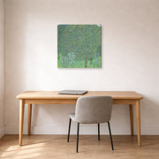 Gallery-wrapped canvas print of Gustav Klimt's 'Rose Bushes Under Trees' displayed on a wall in an office