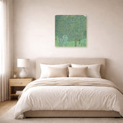 Unframed poster print of Gustav Klimt's 'Rose Bushes Under Trees' displayed on a wall in a bedroom