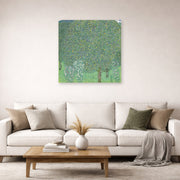 Unframed poster print of Gustav Klimt's 'Rose Bushes Under Trees' displayed on a wall in a living room (image 2 of 2)
