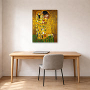 Gallery-wrapped canvas print of Gustav Klimt's 'The Kiss' displayed on a wall in an office