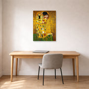 Unframed poster print of Gustav Klimt's 'The Kiss' displayed on a wall in an office