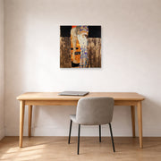 Unframed poster print of Gustav Klimt's 'The Three Ages of Woman' displayed on a wall in an office