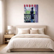 Gallery-wrapped canvas print of Gustave Caillebotte's L'homme au balcon, Boulevard Haussmann displayed on a wall in a bedroom