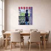 Unframed poster print of Gustave Caillebotte's L'homme au balcon, Boulevard Haussmann displayed on a wall in a dining