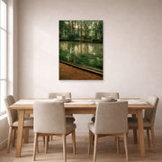 Unframed poster print of Gustave Caillebotte's L'Yerres, pluie displayed on a wall in a dining