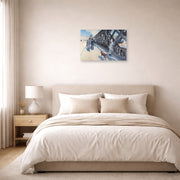 Unframed poster print of Gustave Caillebotte's Le Pont de l'Europe displayed on a wall in a bedroom