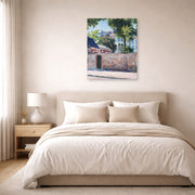 Unframed poster print of Gustave Caillebotte's Maisons À Argenteuil displayed on a wall in a bedroom