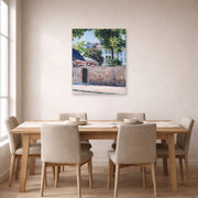 Unframed poster print of Gustave Caillebotte's Maisons À Argenteuil displayed on a wall in a dining