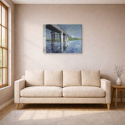 Gallery-wrapped canvas print of Gustave Caillebotte's The Seine and the Railroad Bridge at Argenteuil displayed on a wall in a living room