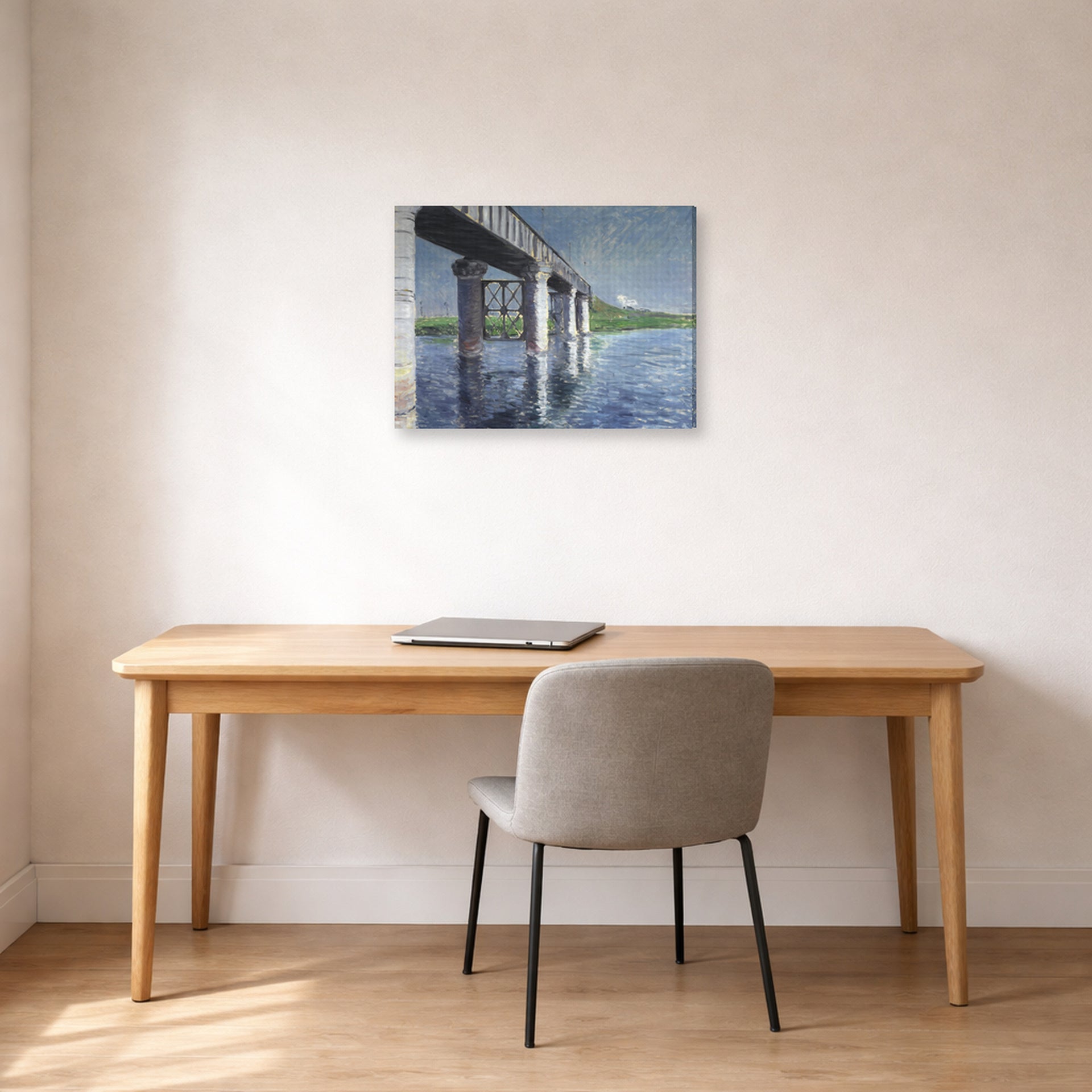 Gallery-wrapped canvas print of Gustave Caillebotte's The Seine and the Railroad Bridge at Argenteuil displayed on a wall in a office