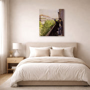 Gallery-wrapped canvas print of Gustave Caillebotte's Un balcon displayed on a wall in a bedroom