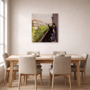 Gallery-wrapped canvas print of Gustave Caillebotte's Un balcon displayed on a wall in a dining