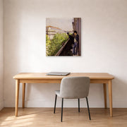 Gallery-wrapped canvas print of Gustave Caillebotte's Un balcon displayed on a wall in a office