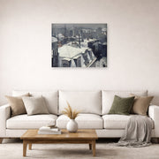 Unframed poster print of Gustave Caillebotte's Vue de toits (Effet de neige) displayed on a wall in a living room