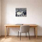 Unframed poster print of Gustave Caillebotte's Vue de toits (Effet de neige) displayed on a wall in a office
