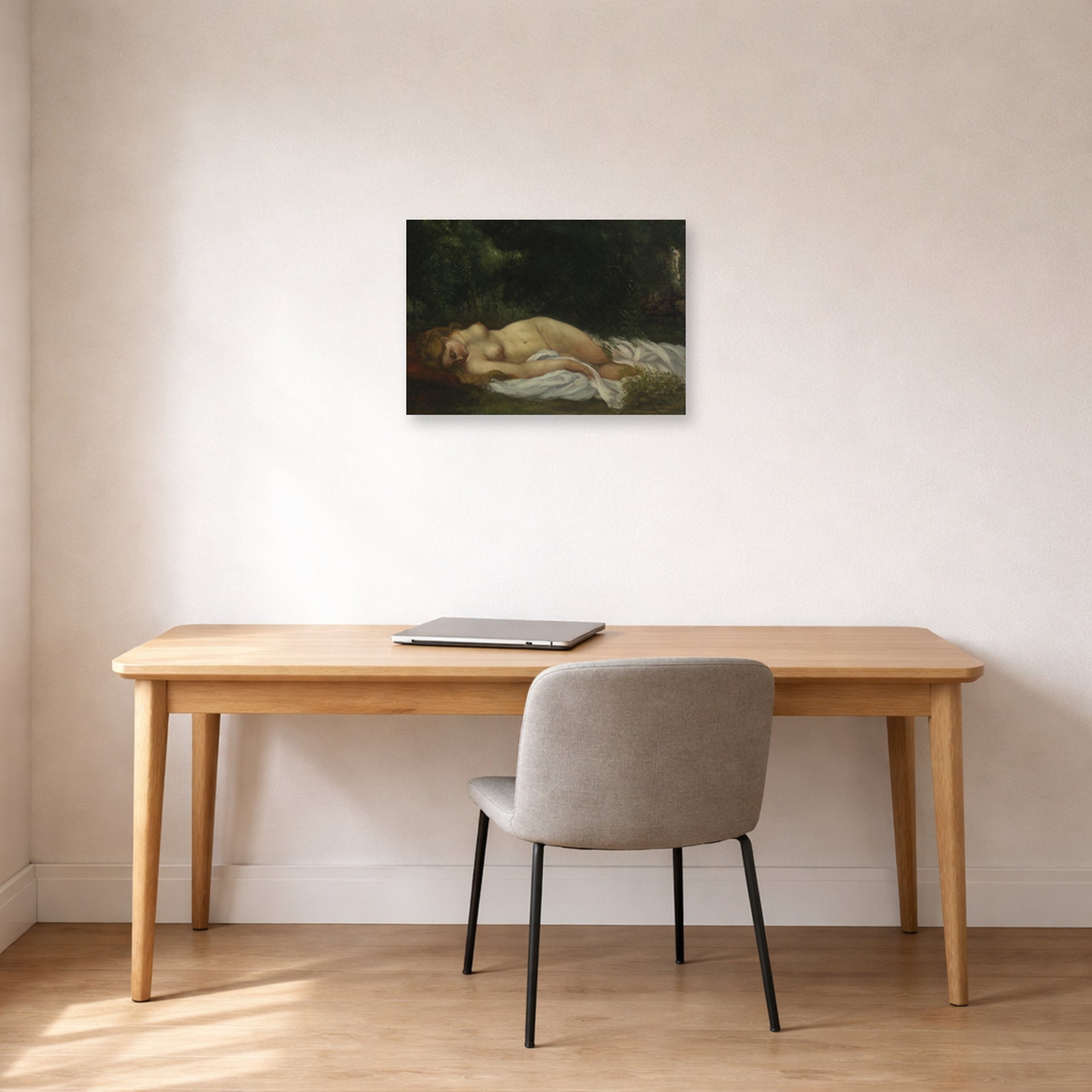 Unframed poster print of Gustave Courbet's Nu Couche displayed on a wall in a home office