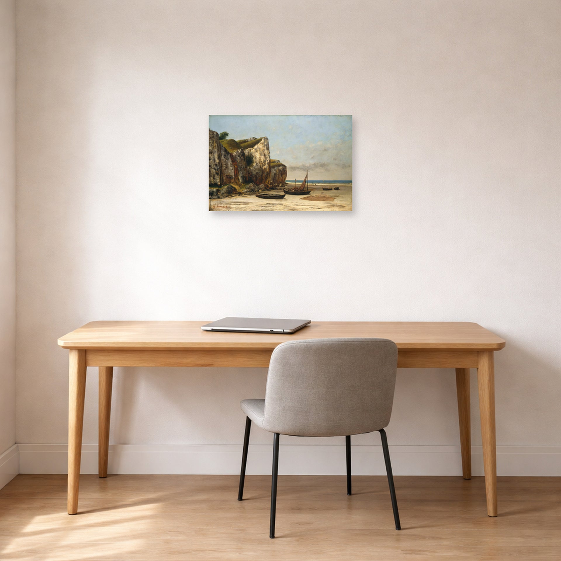 Unframed poster print of Gustave Courbet's Plage de Normandie displayed on a wall in a home office